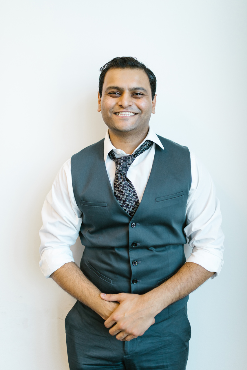 Man in Gray Button Up Shirt Smiling