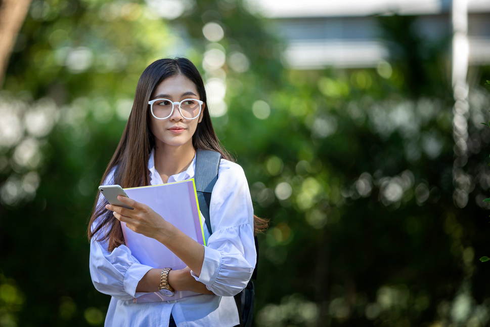 Female Student Wearing Glasses Outdoors